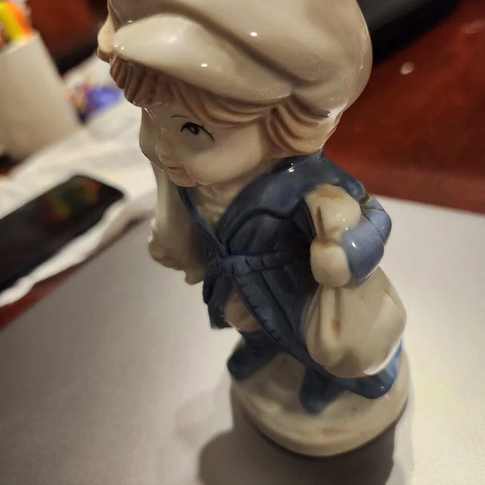 KPM Porcelain Child Figurine Holding Duck And Bag  2H”x3L”